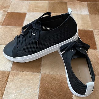 Pre-owned Banana Republic mesh knit sneakers, black with white sole and heel stripe, size 7, available at Capra & Quail.