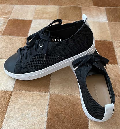 Pre-owned Banana Republic mesh knit sneakers, black with white sole and heel stripe, size 7, available at Capra & Quail.