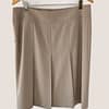 rear view of an Akris Punto khaki skirt showing its pleats and folds