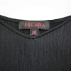 Closeup view of the Escada label and size tag in a black silk camisole
