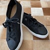 front view of a pair of pre-loved women's Banana Republic black flyknit low-top sneakers