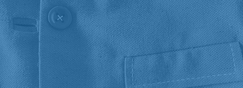 Closeup image of the button, buttonhole and pocket stitching on a jacket with a blue overlay and a header reading Curated Pre-Loved Fashion.