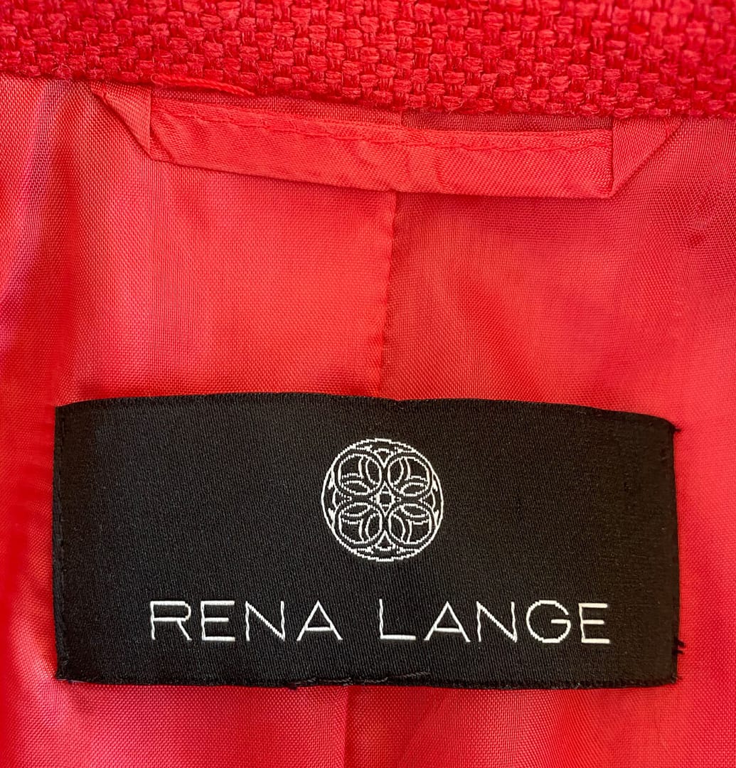 closeup of brand label inside red Rena Lange silk jacket