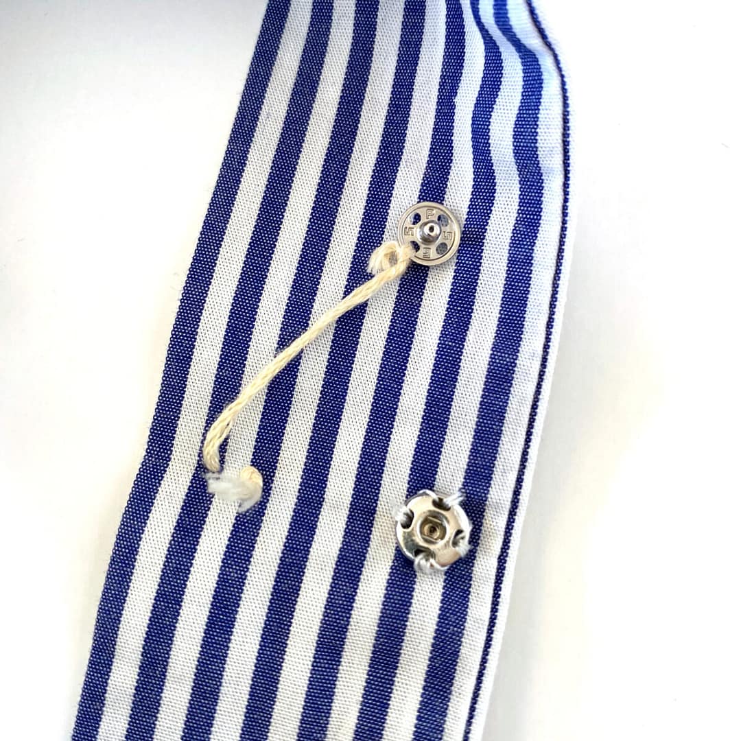 Closeup detail of Banana Republic tank blouse showing a shoulder strap with bra-keep snaps.