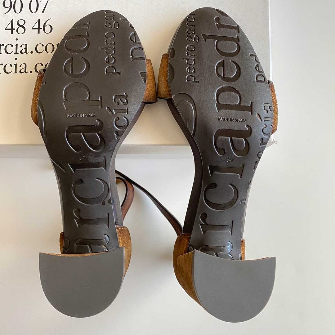 View of the unworn soles of women's Pedro Garcia strappy heels