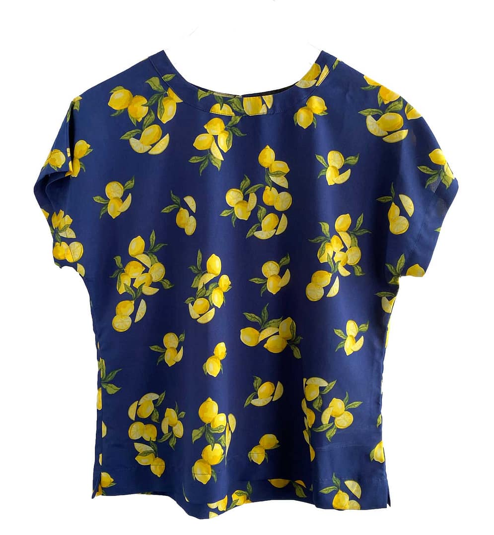 Pre-owned Banana Republic lemon print blouse, petite small, navy blue with yellow lemons, available at Capra & Quail.