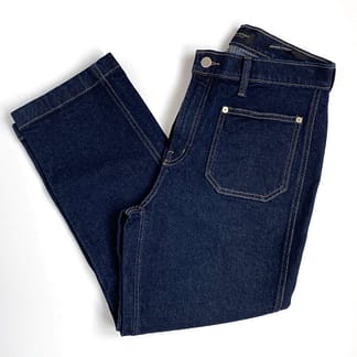 a full overhead view of a pair of Banana Republic cropped denim pants in dark wash folded in half